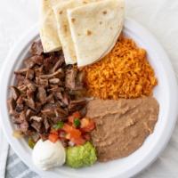 Fajitas · Chunks of fajita steak or chicken. Served with sautéed onions and peppers, rice, pinto beans...