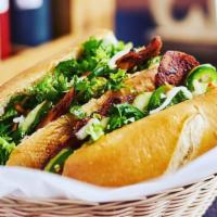 Vegan Grilled Bbq Pork Sandwich · Traditional banh mi filled with home-made mayo fresh cucumber, leafy lettuce, jalapeno, cila...