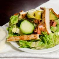 Cobb Salad · Romaine, grilled chicken, bacon, avocado, tomatoes, onions, cucumbers, hardboiled egg, Bleu ...