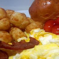 Egg  Platter  · Scrambled Egg topped with Tater Tots, Bacon, Fresh Tomatoes and a Fresh Bread