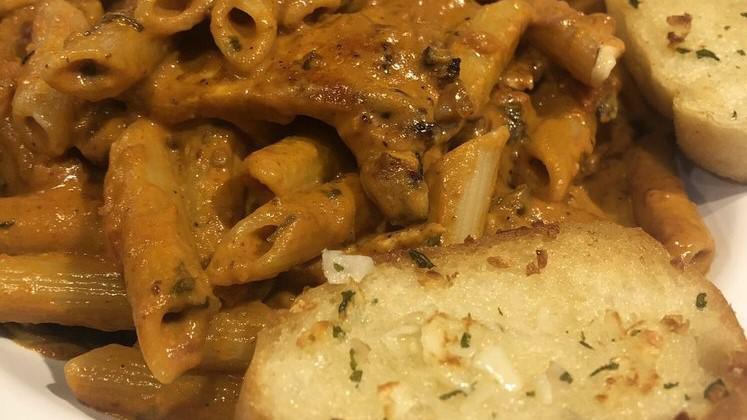 Penne Ala Vodka With Chicken · Penne ala vodka with chicken, and served with garlic bread and side salad.
