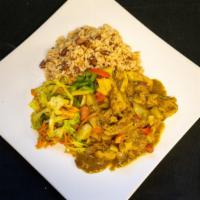 Curry Chicken Platter  · Served with rice and peas steamed cabbage and fried plantains.
