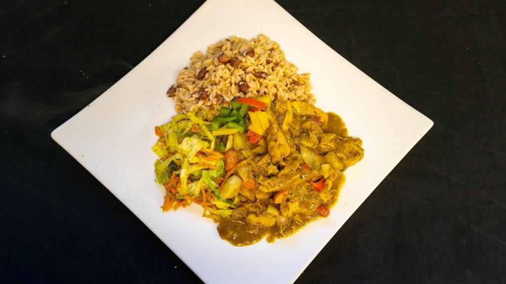 Curry Chicken Platter  · Served with rice and peas steamed cabbage and fried plantains.