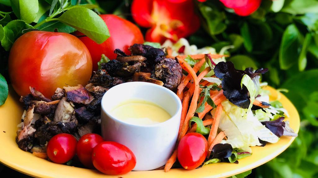 Jerk Chicken Salad · Served with homemade mango dressing. Does not come with platter sides