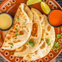 Quesadilla · Recommended. Order of three meat of your choice. With Feather Monterrey cheese.  Add cilantr...