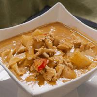 Massaman Curry · Choice of meat simmered in a massaman. curry sauce with peanuts, onions, potatoes,. and red ...
