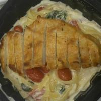 Chicken Alfredo Pasta · Grilled chicken, grape tomatoes, spinach and mushrooms mixed with fettucini, tossed in our a...