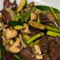 Shaking Beef · Flank steak stir-fried with our famous black pepper sauce with onions, zucchini, mushrooms a...