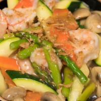 Seafood Claypot · Shrimp, scallops, crab meat, zucchini, carrots, mushrooms, and asparagus in chef's special s...