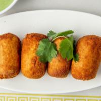 Veggie Bullet · Mixture of vegetables and Cottage cheese coated with bread crumbs.