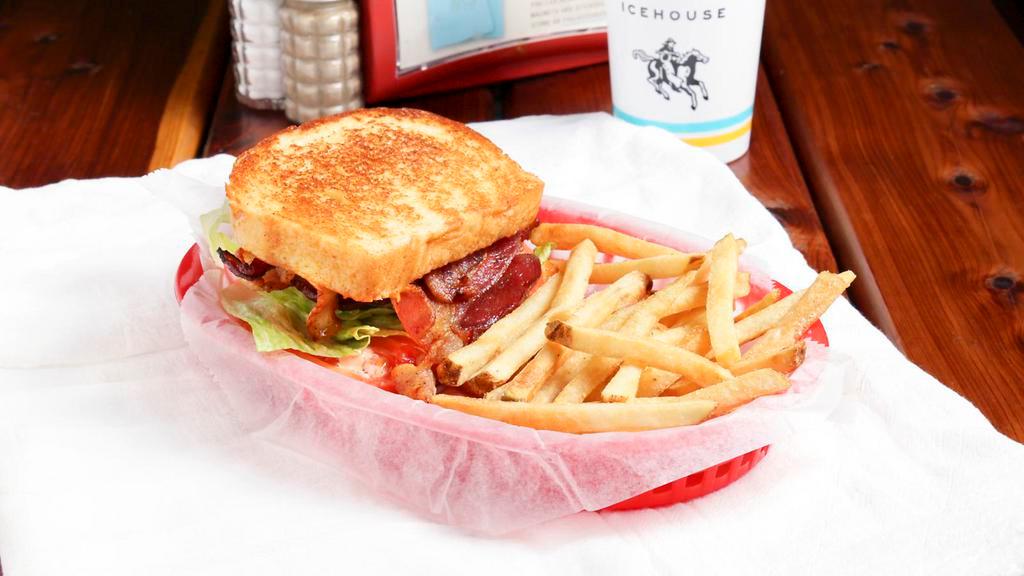 Blt · Bacon heaped on Texas toast with tomatoes, lettuce, and chipotle mayo.