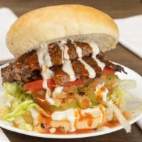 Buffalo Bleu Burger · Spicy. Double patty, buffalo sauce, bleu cheese dressing, caramelized onions, shredded lettu...
