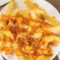 Loaded French Fries · French fries with your choice of sauce, caramelized onions, cheese and bacon.
