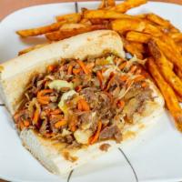 Sukiyaki Sub · Real rib eye beef steak and chicken breast steak on a sub roll with cabbage, carrots, grille...