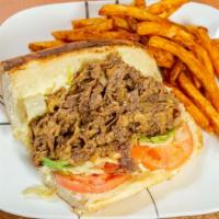 Philly Style Cheese Steak Sub · Real rib eye beef steak or chicken breast steak on a sub roll with Cheddar cheese sauce, let...