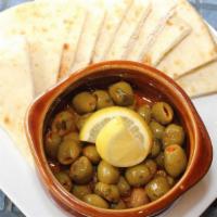 Moroccan Olives · Olives marinated in harissa, preserved lemon, cilantro & parsley.