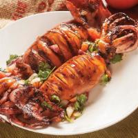 Jumbo Squid (1Pc) · Jumbo squid marinated with house recipe seafood sauce then grilled just right. Stuffed with ...