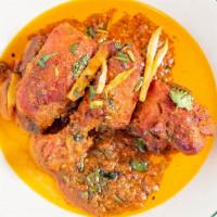 Chicken Karahi · prepared in reduced tomato base sauce with fresh cilantro jalapeño and ginger