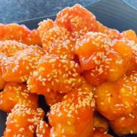 Sesame Chicken · Chunks of chicken breaded and fried with a garlic and ginger brown sauce and sesame seeds.