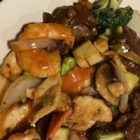 Triple Delight · Sliced chicken, beef, and shrimp, sautéed with an assortment of fresh vegetables in our brow...