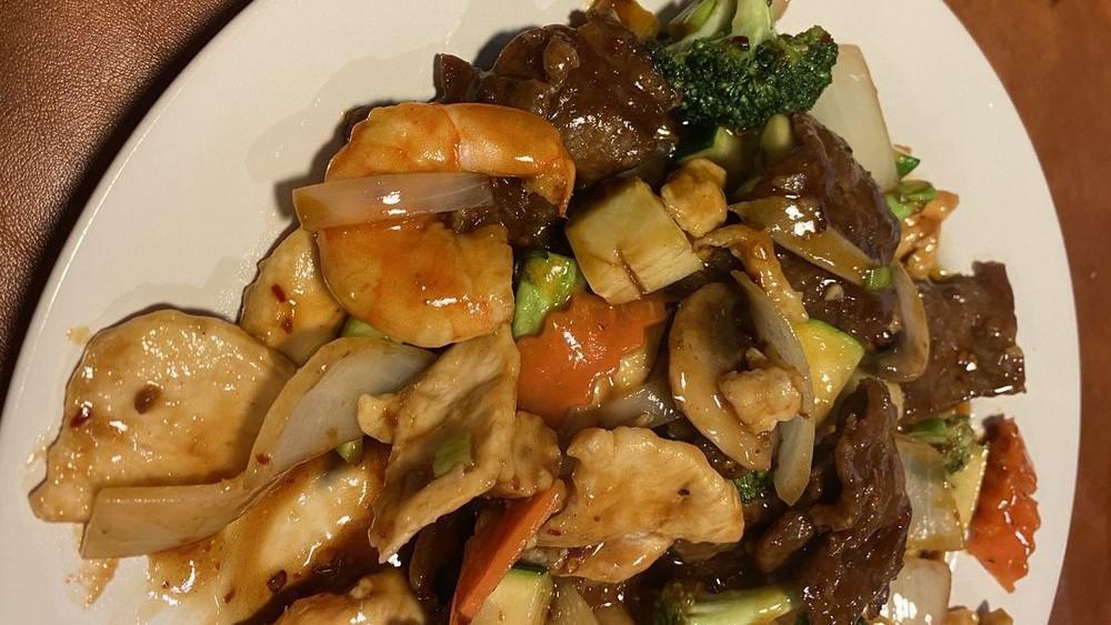 Triple Delight · Sliced chicken, beef, and shrimp, sautéed with an assortment of fresh vegetables in our brown sauce.