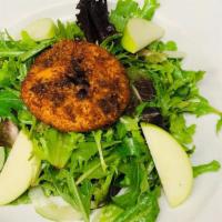 Goat Cheese Salad · Crispy Round of Chevre Goat Cheese atop Mesclun Greens, Green Apple, Cucumber, White Balsami...
