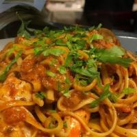 Spicy Shrimp Pasta · Seared Jumbo Shrimp, Mildly Spicy Tomato Cream Sauce, Linguini Pasta