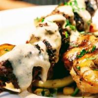 Surf & Turf · Skewer of Filet Mignon Chunks, 2 Jumbo Shrimp, 2 Jumbo Scallops, Grilled & topped with Herb ...