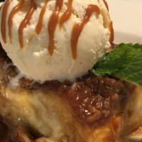 Bread Pudding · Buttery layers of croissants soaked in a vanilla custard base, baked with caramel & topped w...