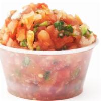 Pico De Gallo · A vibrant mix of delicately chopped onions and tomatoes topped with fresh cilantro and lime.