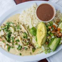 Pollo A La Crema · Chicken with cream. Chicken breast topped with cream. Served with rice, beans, salad, and tw...