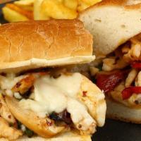Chicken Cheesesteak Sandwich · Delicious sandwich made with Chicken, chopped with cheese and onions, and served on a long r...
