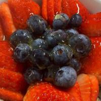 Yogurt Parfait · Fresh strawberries and blueberries low-fat vanilla, yogurt, granola, and honey.