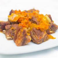 Asun (Barbecued Meat) · Marinated goat meat, chopped into bite-sized pieces, and perfectly garnished with the right ...