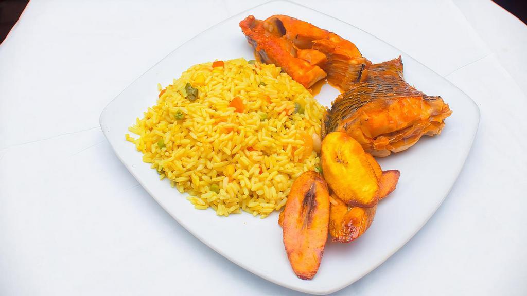 Fried Rice, Plantain With Fresh Fish · Fried rice cooked with white rice, oil, carrot, green peas, green beans, shrimp and liver is garnished with seasoning and spices is served with fresh fish and fried ripe plantain.