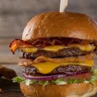 Double Bacon Cheese Burger · Our double bacon cheese burger comes with 2 Quarter pounds beef pattie’s served with America...