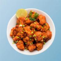 Cauliflower Manchurian Madness · Cauliflower flowerets, seasoned, batter fried and sauteed with green onions and an Indo-Chin...