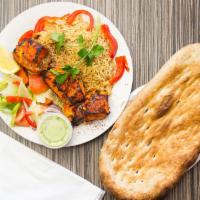 9. Salmon Kabob · Fresh salmon marinated in special herbs and spices, broiled over charcoal. Including bread, ...