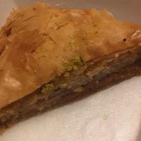 Baklava · Fresh baklava topped with pistachios and a heavenly sweet syrup.