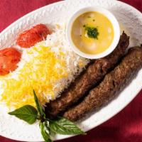 Koubideh (Ground Beef Kabob) · Two strips of charbroiled kabob style ground beef served with grilled tomatoes.