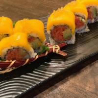 Golden Mango Roll · Spicy tuna, avocado inside, mango and golden tobiko on top, served with special sauce.