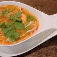  Tom Yum Koong · Hot. Hot and spicy shrimps soup, mushrooms, onions, scallions, green peppers, bean sprouts.