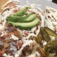 Nachos · Chips topped with your choice of meat: beef or chicken, beans, pico de gallo, cheese, jalape...