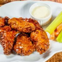 15) Honey Garlic Sauce · Bone-in wings in honey garlic sauce served with celery or carrots and blue cheese or ranch