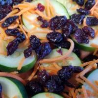 House Salad · Mixed Organic Greens, Shredded Carrots, Cucumber, Tomato and Dried Cranberries.