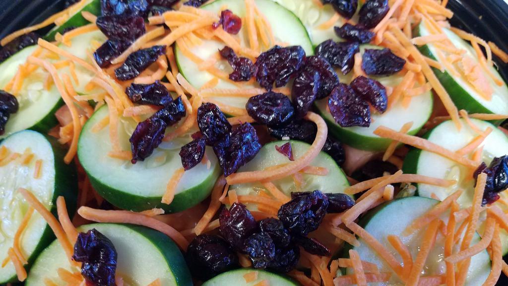 House Salad · Mixed Organic Greens, Shredded Carrots, Cucumber, Tomato and Dried Cranberries.