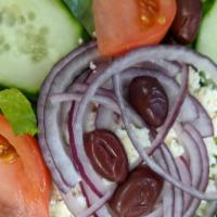 Greek Salad · Organic Spring Mix, Tomatoes, Red Onion, Cucumber, Feta Cheese and Kalamata Olives.