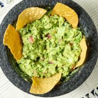 Fresh Guacamole · Denotes one of our gluten-free items. Prepared at your table with jalapeños, tomatoes, onion...