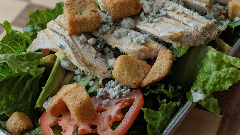 Chopped Salad · Mixed greens, chicken breast, grape, tomatoes, avocado, cucumbers, crumbled blue cheese and croutons.