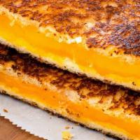 Loaded Grilled Cheese · Cheddar, american, provolone and swiss on wheat.